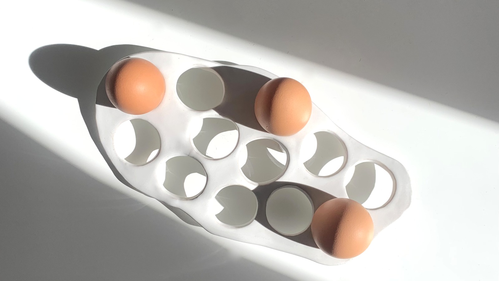 Stoneware egg tray with fresh eggs